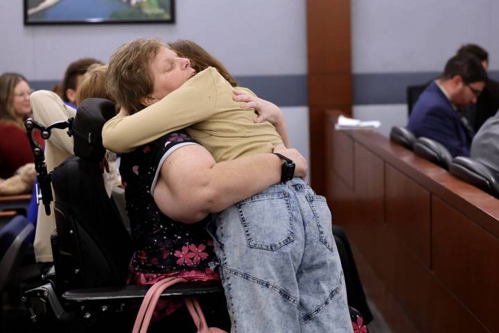 Amber Reedy hugs her daughter Isabella McPherson, 12, after Isabella gave a victim impact state ...