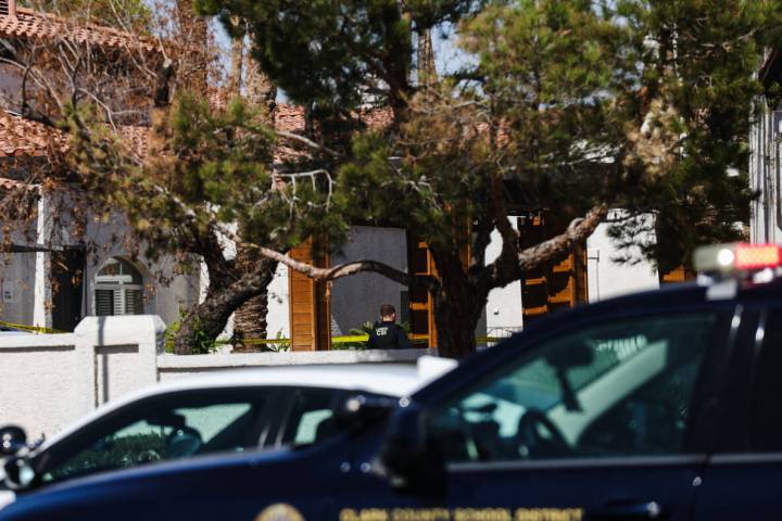 Police investigate the scene of an officer involved shooting near East Tropicana Avenue and Sou ...